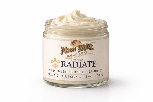 Organic Radiate lemongrass body butter in glass jar with whipped shea butter texture for hydrated glowing skin